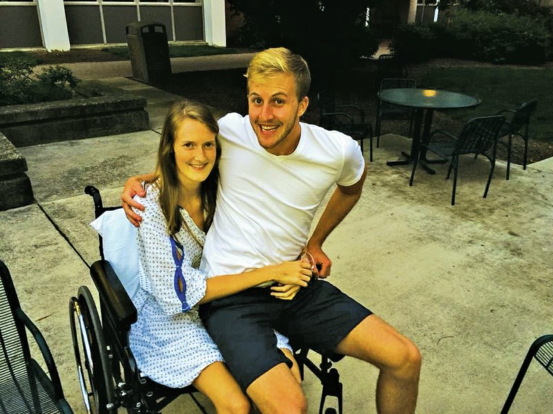 Courtesy Photo Melissa Clement and her boyfriend, Sam Crocker, relax at UK Chandler Hospital in Lexington, Kentucky, about three weeks after she collapsed while playing volleyball with friends.