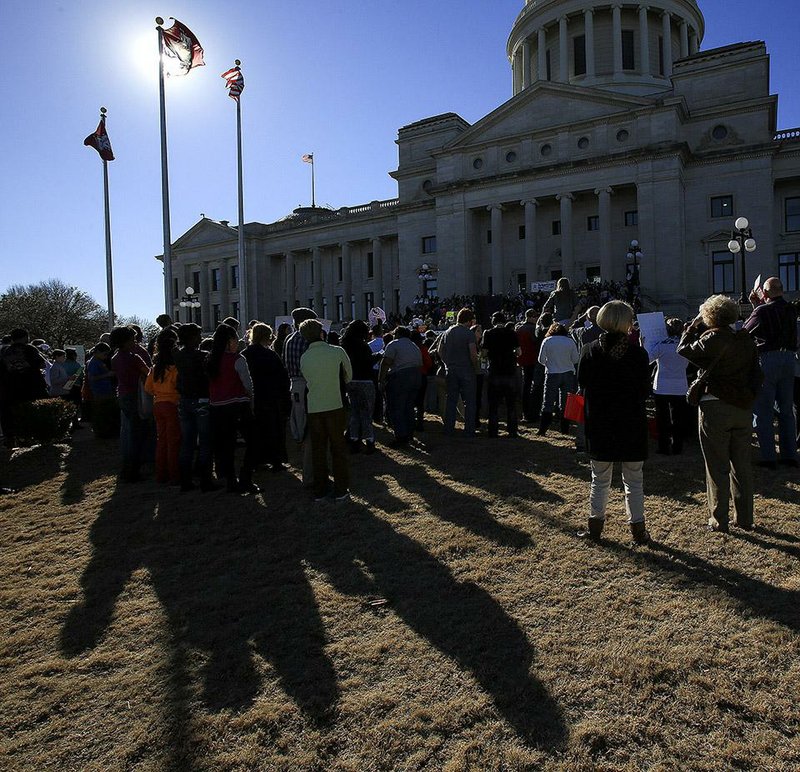 Arkansas Democrat-Gazette/STATON BREIDENTHAL --1/19/15-- A crowd listens to speakers after marching to the steps of the state Capitol Sunday during the March for Life.