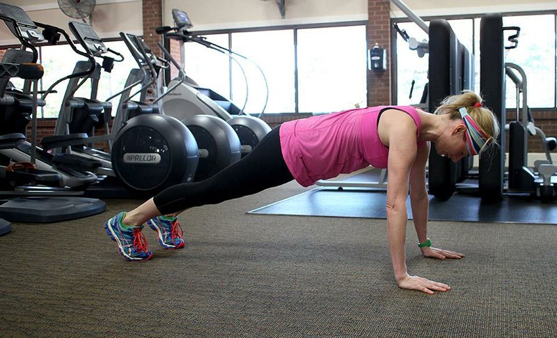 Arkansas Democrat-Gazette/CELIA STOREY
Holly Sessions does step 1 of the Hip Jack exercise for Matt Parrott's Master Class column in ActiveStyle