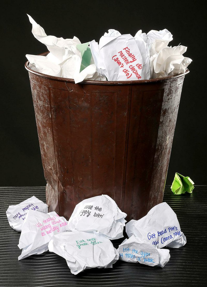 Arkansas Democrat-Gazette photo illustration/JOHN SYKES JR. - Cover story is about NewYear's resolutions and why setting out to become a new you is doomed. It may be a new year but you are still the same old you. Want a centerpiece image of a trashcan surrounded by balled up lists of resolutions.