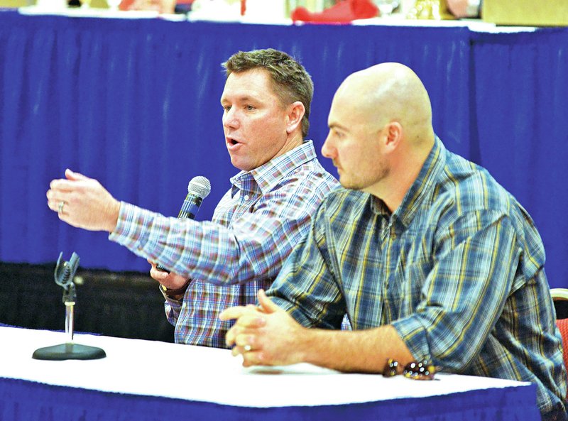 NWA Democrat-Gazette/BEN GOFF Vance Wilson, left, manager of the Northwest Arkansas Naturals, and Clint Robinson, former Naturals player and member of the Northwest Arkansas Naturals Hall of Fame, answer audience questions Monday during the annual Northwest Arkansas Naturals Hot Stove Luncheon at the Holiday Inn Convention Center in Springdale.