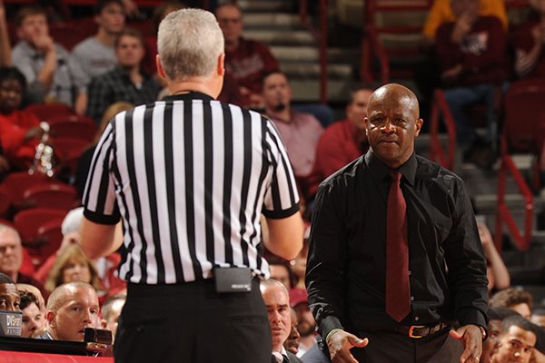 Arkansas coach Mike Anderson speaks to a game official against Mississippi during the second half of play Saturday, Jan. 17, 2015, in Bud Walton Arena in Fayetteville.