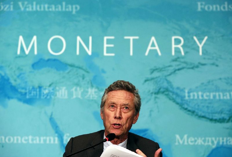 Olivier Blanchard, the International Monetary Fund’s research department director, speaks Tuesday at a news briefing in Beijing. 