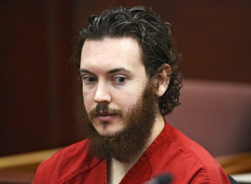 This June 4, 2013 file photo shows Colorado movie theater shooting suspect James Holmes, whose trial is to begin with lengthy jury selection on Jan. 20, 2015, sits in Arapahoe County District Court in Centennial, Colo. Psychiatrists and attorneys interviewed by The Associated Press say that it would be unlikely that Holmes would be released from a state mental institution should a jury find him not guilty by reason of insanity. 