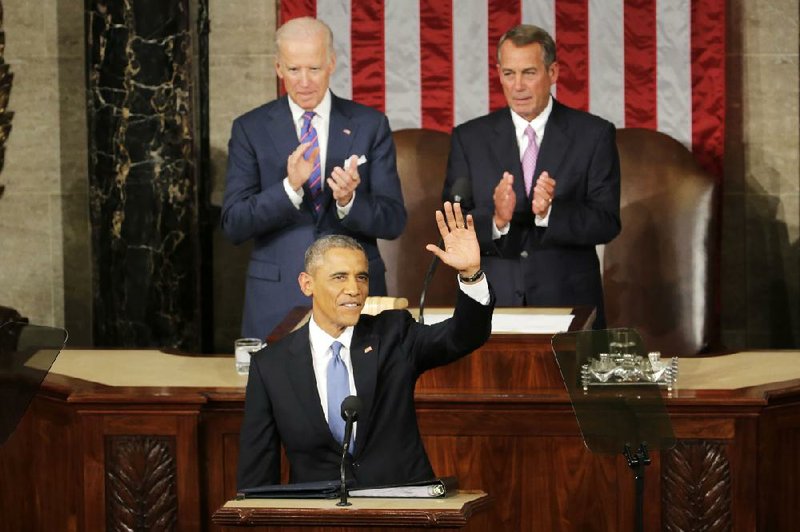 Vice President Joe Biden (left) and House Speaker John Boehner join in applauding President Barack Obama at the start of his State of the Union speech Tuesday, Jan. 20, 2015, to a joint session of Congress. 