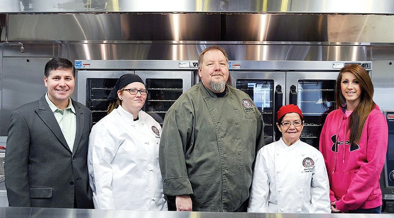 Shown in the new Ozarka Cafe’s kitchen, from left, are Ozarka College Provost Dennis C. Rittle, cafe food preparation technician Samantha Clements, culinary arts department head chef Lou Rice, cafe manager chef Miriam “Mimi” Newsome and cafe cashier Brooklyn Ramsey.