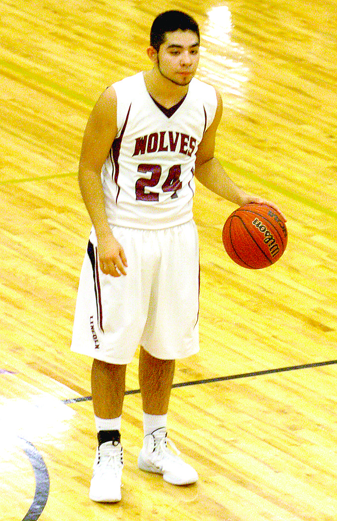 MARK HUMPHREY ENTERPRISE-LEADER Ossy Escareno could handle the basketball with either hand which made him a difficult assignment for opponents to keep from driving to the goal. Escareno was named All-Conference and All-State and is 2014 Male Athlete of the Year at Lincoln as selected by the Enterprise-Leader.