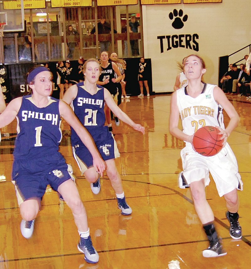 BEN MADRID ENTERPRISE-LEADER Prairie Grove junior Mattie Hartin drives to the hoop against Shiloh Christian. Prairie Grove won 56-14 in 4A-1 girls basketball action on Jan. 6.