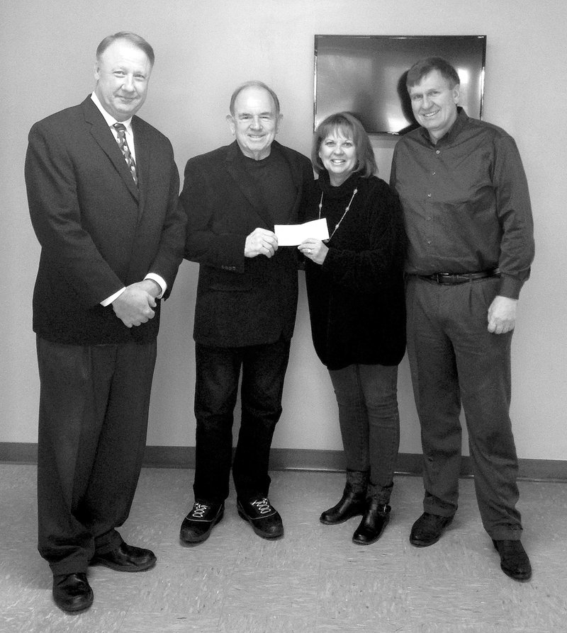 Submitted Photo Aubrey Plauche, with the Knights of Columbus, presented the Gravette School District special education department with a check for $5,000 which will be used in the school&#8217;s self contained classrooms. The supplies are helpful in teaching daily-life skills to the students. Another portion of the funds will be used to purchase supplies for the students with physical disabilities. The school district is grateful for the donation, and will continue to use the money in a positive way for for the students at Gravette School District. Pictured above in the check presentation are Richard Page, Gravette School District superintendent; Sharla Heltzel, special education director; Aubrey Plauche, Knights of Columbus; and Jay Oliphant, Gravette School Board president.