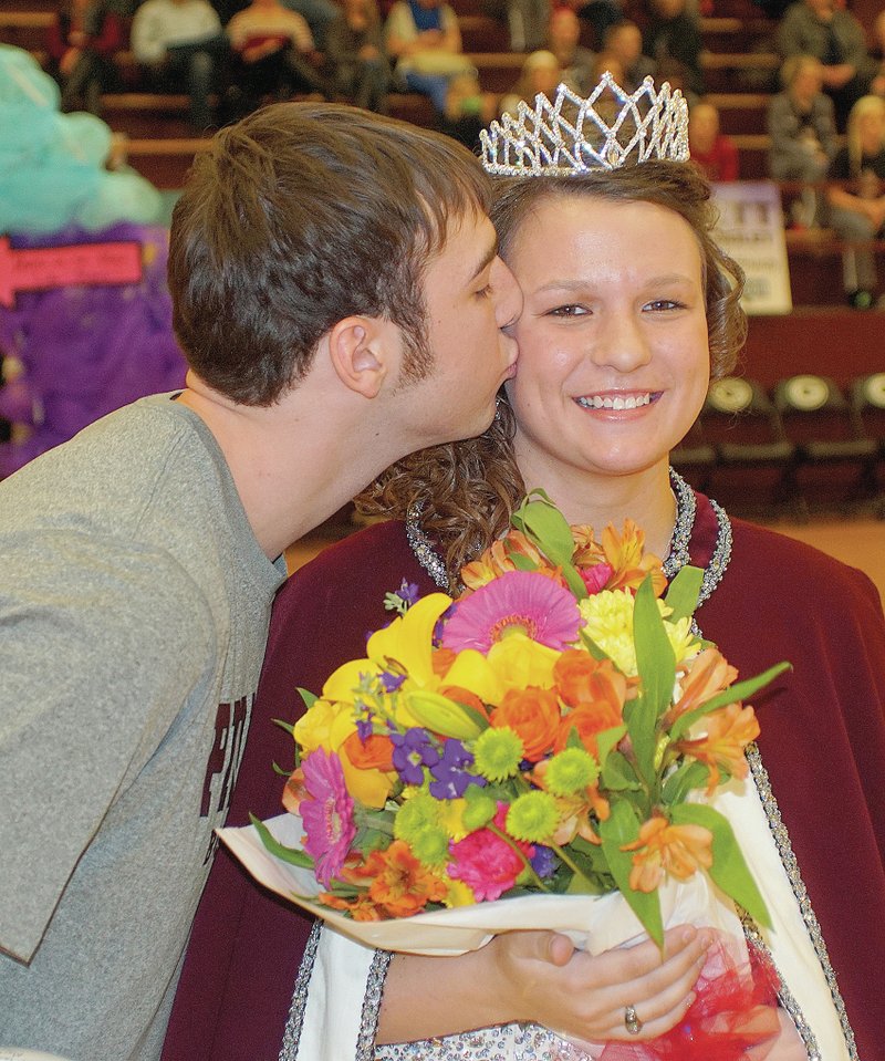 Photo by Randy Moll Gentry coronation king, Brent Barker, gives Rachel Lawrence, Gentry senior who was crowned queen, the ceremonial kiss at the basketball coronation on Friday night. More photos are on Page 8A, with photos of the entire court on the Eagle Observer website.