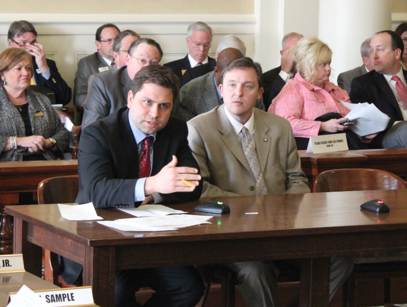 Senate President Jonathan Dismang, left, presents a bill Wednesday that would enact Gov. Asa Hutchinson's middle-income tax cut .