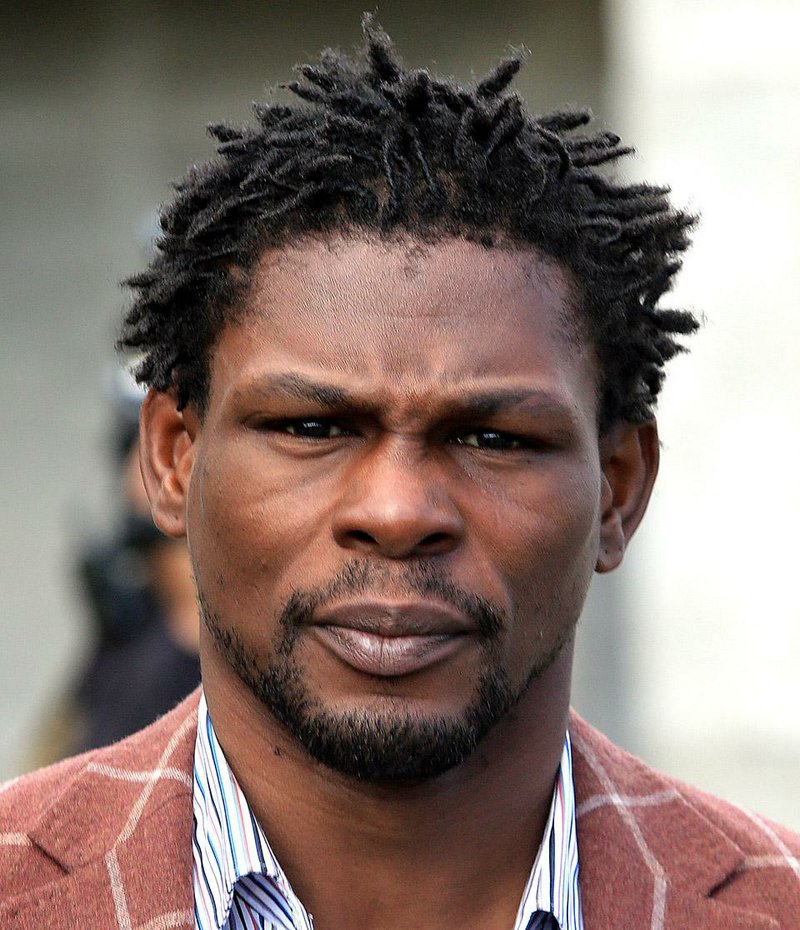 Boxing champion Jermain Taylor turned himself in to authorities Wednesday
