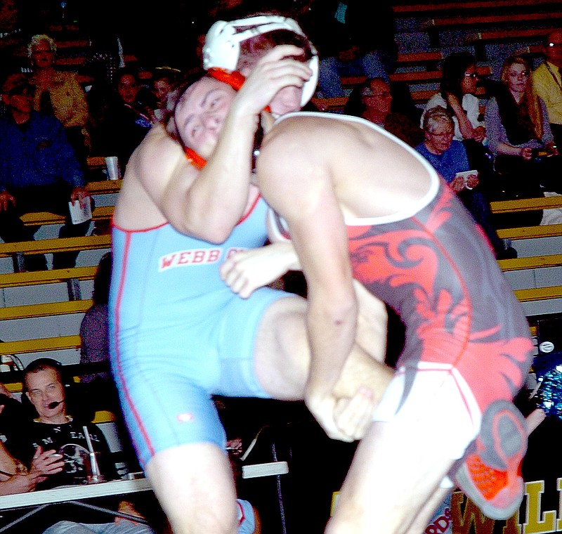 RICK PECK MCDONALD COUNTY PRESS McDonald County&#8217;s Christopher Dalton takes Webb City&#8217;s Garret Rodgers down on his way to recording an 11-1 decision during the Mustangs 42-40 loss to the Cardinals Sept. 15 at Neosho High School.