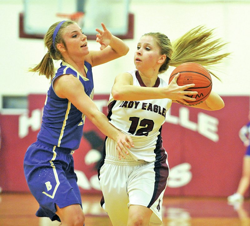 NWA Democrat-Gazette/Michael Woods &#8226; @NWAMICHAELW Chandler Sone, right, of Huntsville tries to get the ball past Berryville defender Hannah Noble during Tuesday&#8217;s 4A-1 Conference game at Charles Berry Gymnasium in Huntsville. The Lady Eagles broke a 29-29 tie with a fourth quarter surge and knocked off the league-leading Lady Bobcats to force a three-team tie atop the league standings after the first round of conference games.