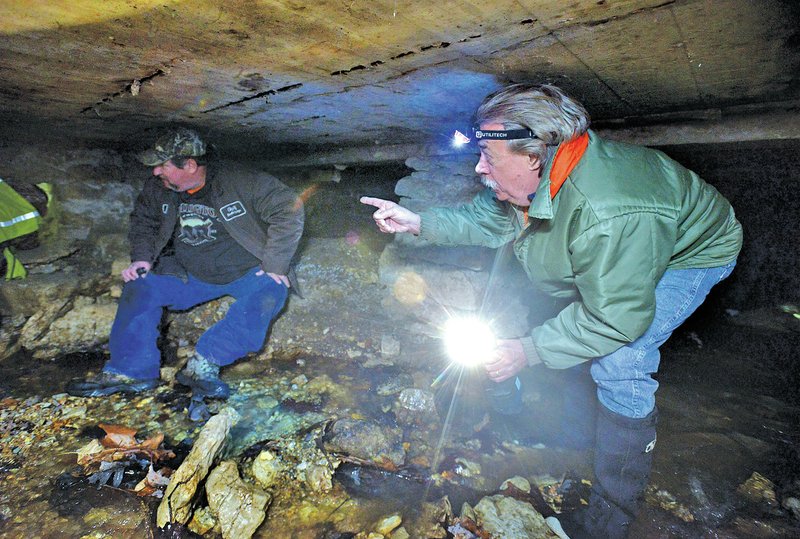 NWA Democrat-Gazette/BEN GOFF Robert D. &#8216;Butch&#8217; Berry, right, mayor of Eureka Springs, joins engineers and city officials on a tour Wednesday of the storm drains and foundations under The Auditorium and adjacent structures in downtown Eureka Springs.