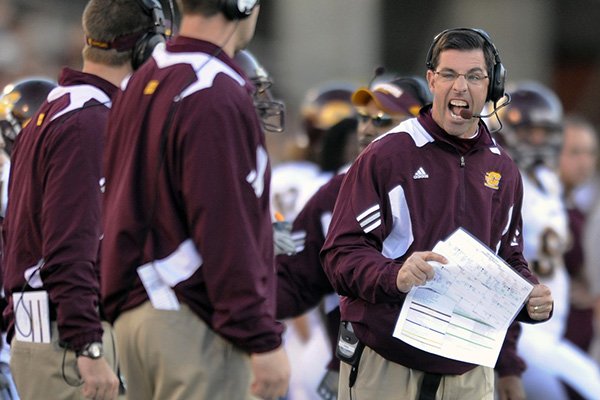 Central Michigan coach Dan Enos reacts to a play during a game against Navy on Saturday, Nov. 13, 2010, in Annapolis, Md. (AP Photo/Gail Burton)