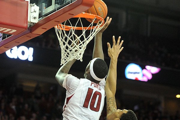 Arkansas' Bobby Portis tips in a shot as time expires in overtime Thursday, Jan. 22, 2015 at Bud Walton Arena in Fayetteville. 