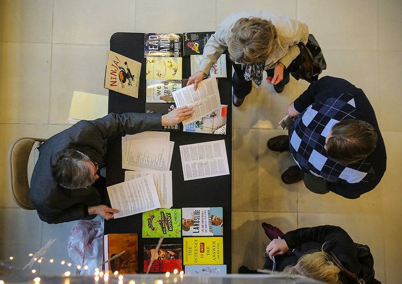 1/22/2015
Arkansas Democrat-Gazette/STEPHEN B. THORNTON
Arkansas Literary Festival Director Brad Mooy, left, passes out information on festival authors to Cathy Spivey, top right, Michael Taggard and Jennifer Willis, bottom right, after a presentation announcing upcoming Central Arkansas Library Systems events Thursday at the Ron Robinson Theater in Little Rock. CALS announced some of the more than 80 presenters to be featured at the twelfth annual Arkansas Literary Festival, April 23-26, 2015. They also announced Arkansas Sounds' monthly concert series and film series lineups for the Ron Robinson Theater and other library programs.