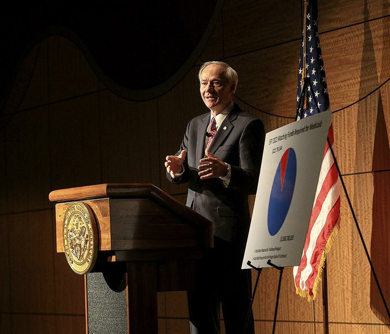 Arkansas Democrat-Gazette/STATON BREIDENTHAL --1/22/15--  Gov. Asa Hutchinson speaks Thursday at the University of Arkansas for Medical Sciences in Little Rock  about the private option. Hutchinson said the private option will continue until Dec. 31, 2016 and is forming a task force to draft a solution for health care after that date. 

