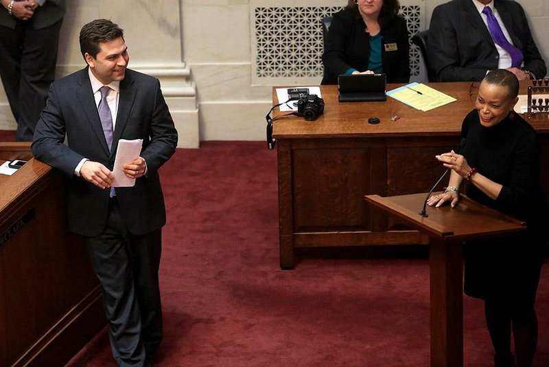 Arkansas Democrat-Gazette/RICK MCFARLAND  --- 01/22/15--  Senate Pro-tem Jonathan Dismang, R-Beebe, smiles as Sen. Joyce Elliott, D-Little Rock, explains why she is voting against SB 6, the middle class tax relief act of 2015, after Dismang brought the bill up in the Senate Thursday at the state Capitol. Elliott was one of 3 that voted against the act.