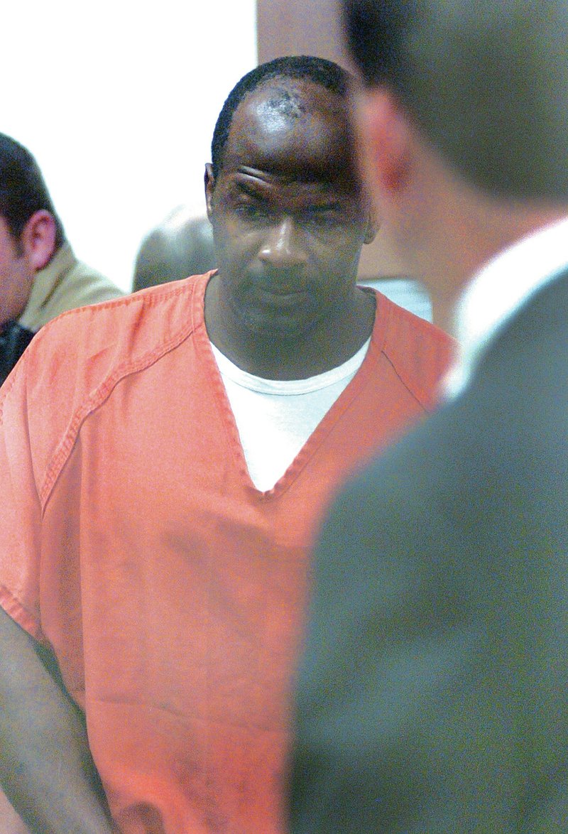 FILE PHOTO Ricky Anderson walks into Judge Ray Reynolds courtroom for his July 2009 arraignment at the Washington County Detention Center in Fayetteville.
