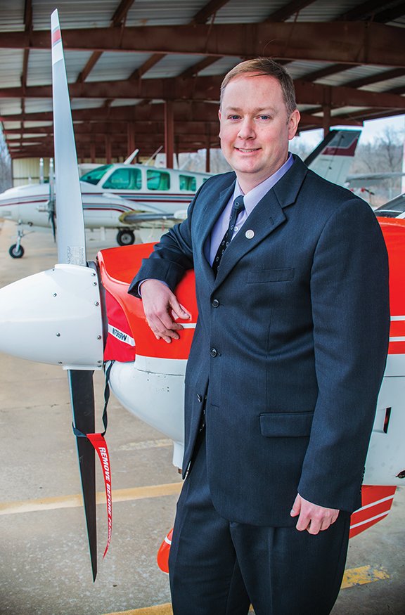 Nick Lenczycki, director of aviation at Ozarka College, stands with an airplane at the Melbourne Municipal Airport. Lenczycki said he is excited to get students started in the program, which will include aviation basics, safety instruction and flight time.