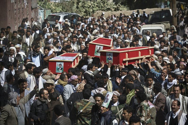 Houthi Shiite Yemeni carry coffins of fellow men killed during recent clashes with presidential guard forces, during their funeral procession in Sanaa, Yemen, Friday, Jan. 23, 2015. Shiite rebels have called on supporters to hold mass rallies, a day after the country's embattled president and Cabinet resigned. 