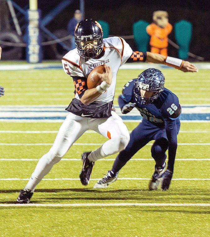 Batesville quarterback Kenton Crawford carries the ball against Pulaski Academy in the Class 4A state semifinals. Crawford is the Three Rivers Edition Offensive Player of the Year.