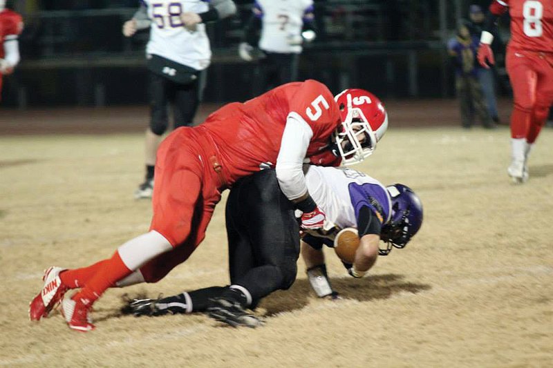 Dardanelle’s Parker Witt, No. 5, makes a tackle against Fountain Lake during the 2014 season. Witt is the River Valley & Ozark Edition Defensive Player of the Year.