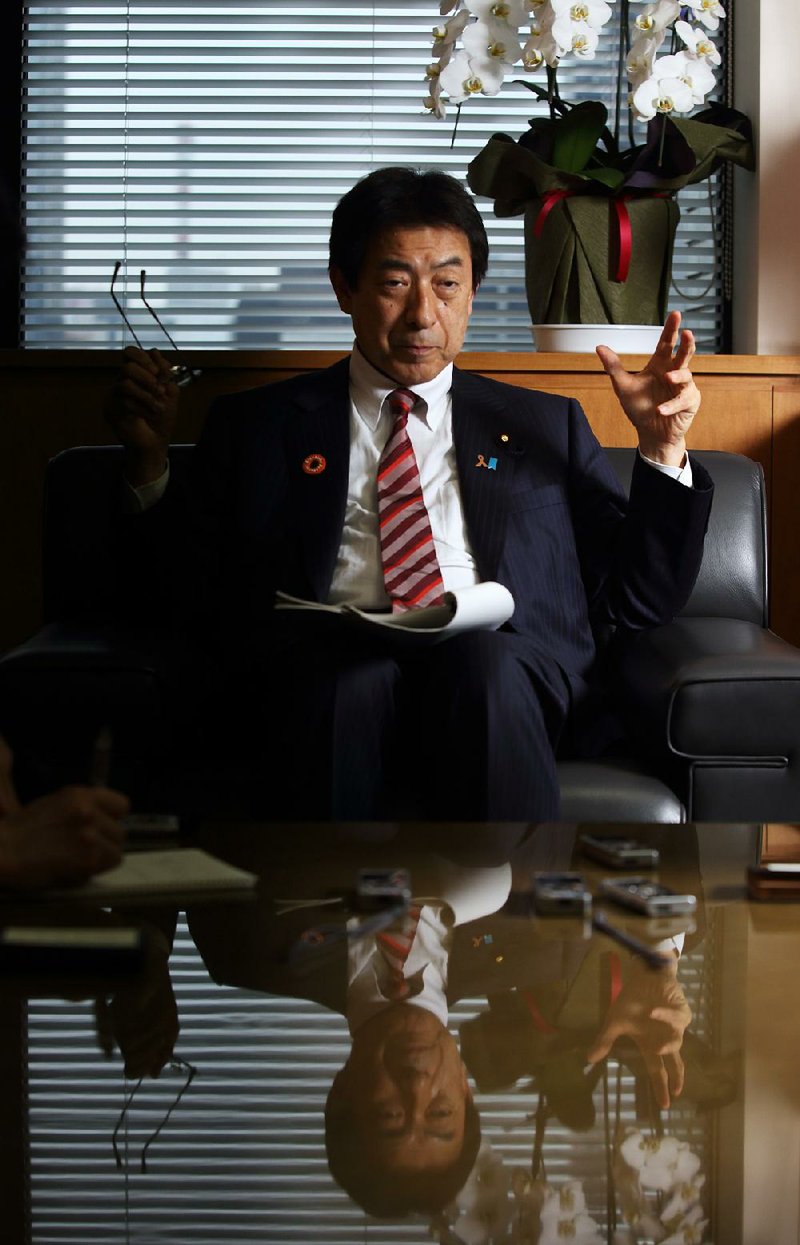 Yasuhisa Shiozaki, Japan's health, labor and welfare minister, gestures as he speaks during an interview in Tokyo, Japan, on Wednesday, Jan. 21, 2015. Japan's Government Pension Investment Fund is closing in on completing a governance overhaul, said the minister in charge of the $1.1 trillion retirement pool.  Photographer: Tomohiro Ohsumi/Bloomberg *** Local Caption *** Yasuhisa Shiozaki