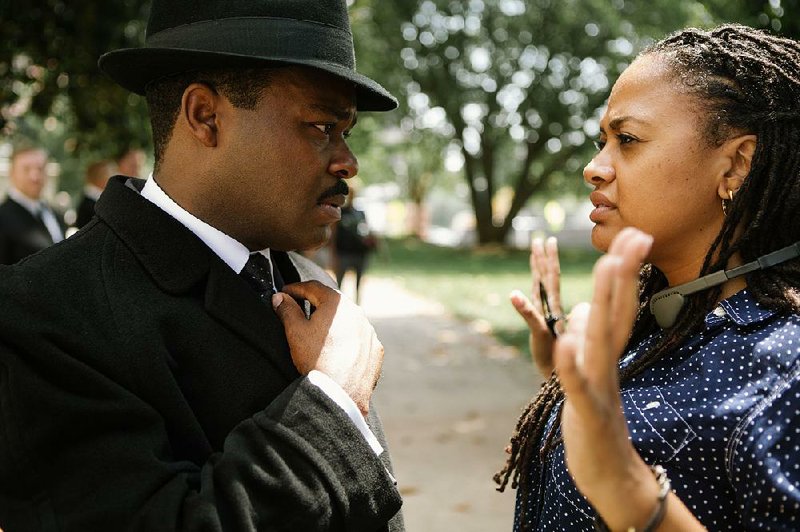 Left to right: David Oyelowo (as Dr. Martin Luther King, Jr.) discusses a scene with Director/Executive Producer Ava DuVernay on the set of SELMA, from Paramount Pictures, PathÈ, and Harpo Films.
SEL-13980