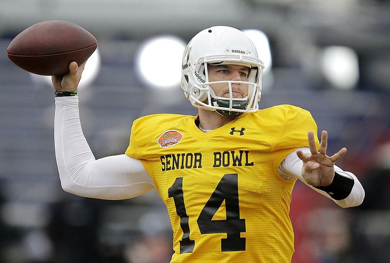 Baylor quarterback Bryce Petty sets back to pass the ball during NCAA college football practice for the Senior Bowl, Thursday, Jan. 22, 2015, at Ladd-Peebles Stadium in Mobile, Ala. (AP Photo/Brynn Anderson)