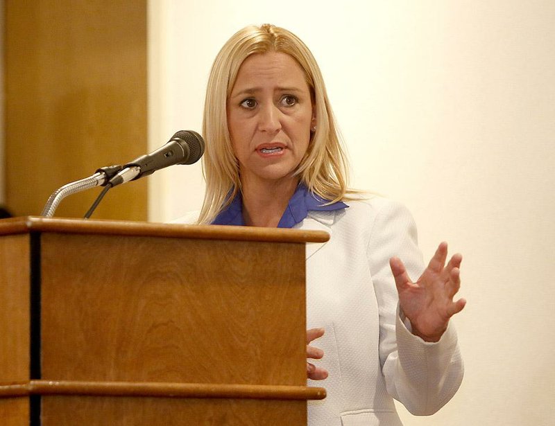 NWA Media/DAVID GOTTSCHALK - 7/17/14 - Leslie Rutledge, a republican candidate for the State of Arkansas Attorney General, speaks Thursday July 17, 2014 at the Northwest Arkansas Political Animals Club meeting in Fayetteville. Democratic candidate Nate Steel also spoke.
