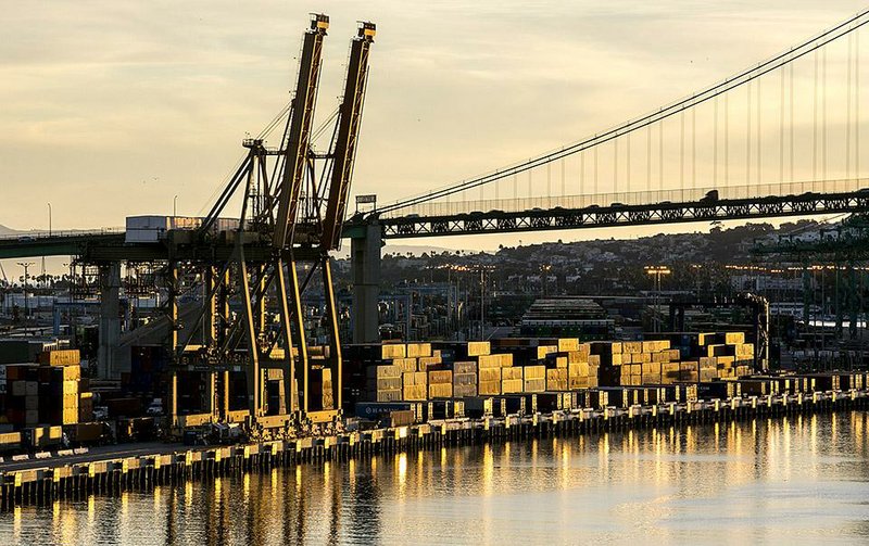 In this Jan. 14, 2015 photo, shipping containers are seen stacked up at the Port of Los Angeles. Port Negotiators trying to resolve labor strife at West Coast seaports took Thursday, Jan 22, 2015, off, as dockworkers gathered to rally against employers they say are trying to exploit a crisis of cargo congestion at harbors that handle about $1 trillion worth of goods annually. As for congestion, dockworkers say they're not culpable and cite broader problems with the supply chain, including a shortage of truck beds to haul containers from yards to distribution warehouses. (AP Photo/Damian Dovarganes)