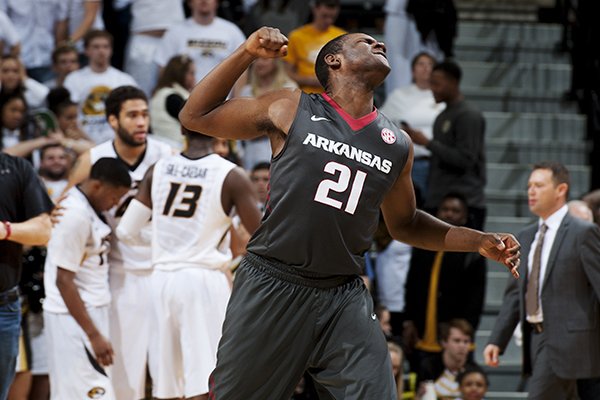 Arkansas' Manuale Watkins, right, pumps his fist as he celebrates his team's 61-60 victory as the Missouri team walks off the court after an NCAA college basketball game Saturday, Jan. 24, 2015, in Columbia, Mo. (AP Photo/L.G. Patterson)