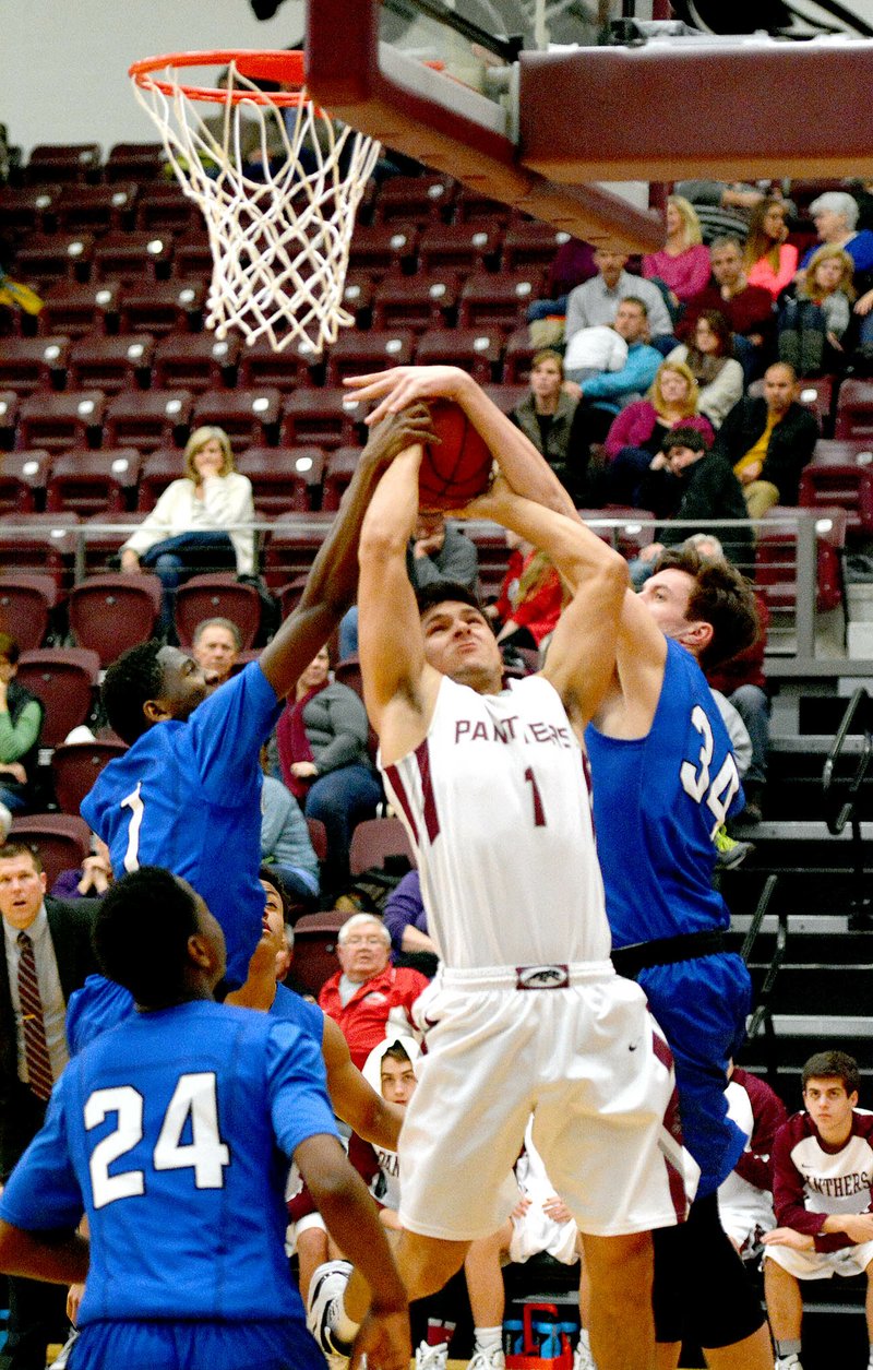 Bud Sullins/Special to Siloam Sunday Siloam Springs senior Keetun Pierce goes up for the shot while Conway&#8217;s Prentice Mullins, left, and John Nekonchuck, right, try to block his shot during Friday&#8217;s game at Panther Activity Center.