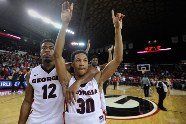 Georgia guard Kenny Gaines (12) and Georgia guard J.J. Frazier (30) celebrate after an NCAA college basketball game against Florida, Saturday, Jan. 17, 2015, in Athens, Ga. Georgia won 73-61. (AP Photo/The Banner-Herald, AJ Reynolds)