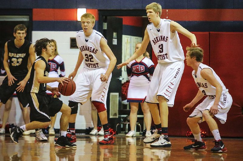 1/20/2015
Arkansas Democrat-Gazette/STEPHEN B. THORNTON
Arkansas Baptist brothers Brandon Vanover (32) left, and Connor Vanover (23), right, tower over their teammates and Pottsville players during the first half of their game Tuesday evening in Little Rock. THIS IS FOR FUTURE STORY ON VANOVER BROTHERS