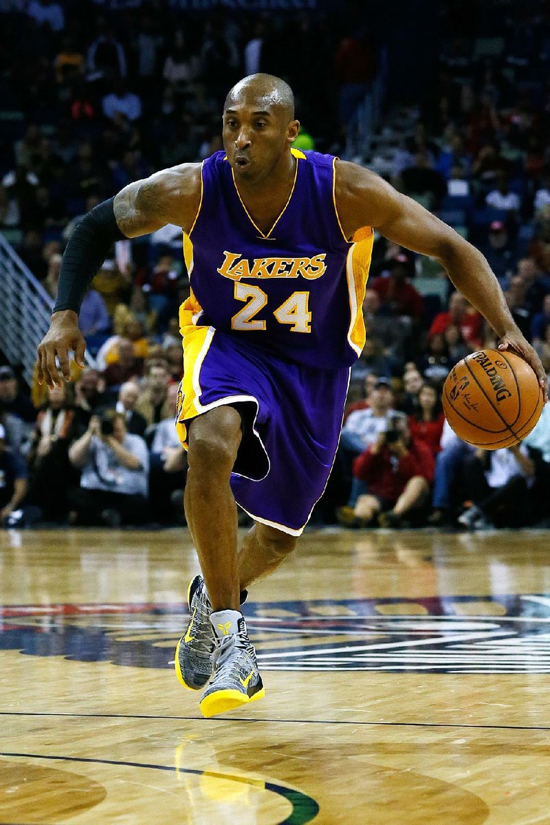 FILE - In this Wednesday, Jan. 21, 2015, file photo, Los Angeles Lakers guard Kobe Bryant (24) drives with the ball during the first half of an NBA basketball game in New Orleans. The team announced Bryant's surgery Monday, Jan. 26, 2015, to repair his torn rotator cuff. The surgery has been scheduled for Wednesday morning. A timeline estimate for Bryant’s return will be issued following the surgery. (AP Photo/Jonathan Bachman, File)