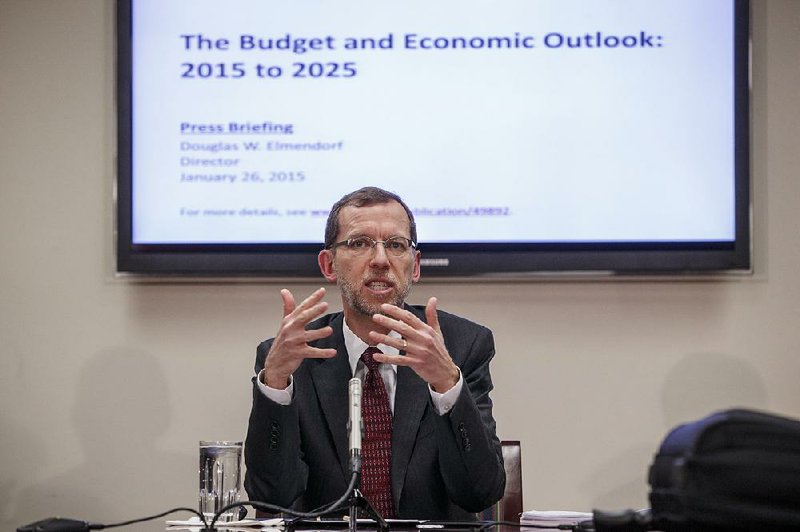 In this file photo former Congressional Budget Office Director Douglas W. Elmendorf holds a briefing for reporters on the CBO's updated budget and economic outlook, Monday, Jan. 26, 2015, on Capitol Hill in Washington in Washington. 
(AP Photo/J. Scott Applewhite)