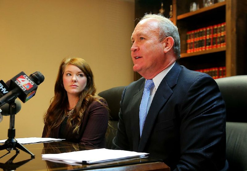 1/26/2015
Arkansas Democrat-Gazette/STEPHEN B. THORNTON
Attorney Whitney Murph, left, listens as Attorney Hal Cook announces Monday in Little Rock a lawsuit against Arkansas Funeral Care and it's manager Leroy Wood on behalf of a Arkansas family who claim that the Jacksonville funeral home botched the service of their loved one in November of last year.(MURPH IS CQ WITH NO "y")