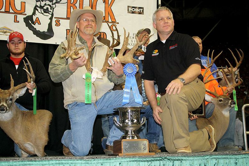  Arkansas Democrat-Gazette/BRYAN HENDRICKS
Don Kittler won the 25th annual Arkansas Big Buck Classic Sunday with the rack of a whitetailed deer he killed in Prairie County that scored 207 7/8 Boone and Crockett. His buck was the biggest of six that qualified for the Boone and Crockett All-Time Awards book. (Lev Bradford of Bradford Marine and ATV is the guy in the black shirt).