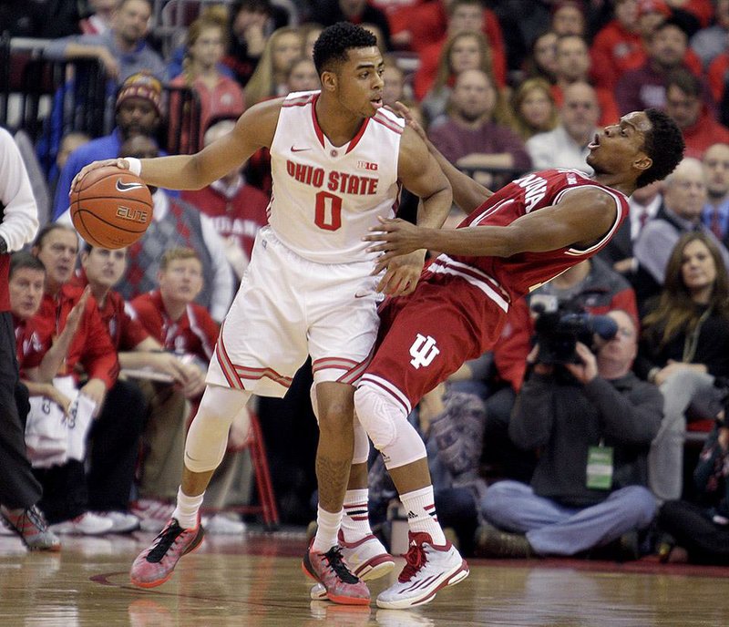 Ohio State's D'Angelo Russell, left, posts up against Indiana's Yogi Ferrell during the first half of an NCAA college basketball game Sunday, Jan. 25, 2015, in Columbus, Ohio. (AP Photo/Jay LaPrete)