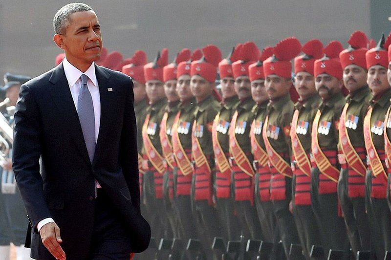 U.S. President Barack Obama inspects a Guard of Honor during a ceremonial reception at the Indian Presidential Palace in New Delhi, India, Sunday, Jan. 25, 2015. Obama is the first American leader to be invited to attend India's Republic Day festivities, which commence Monday and mark the anniversary of the enactment of the country's democratic constitution.  (AP Photo/Press Trust of India)