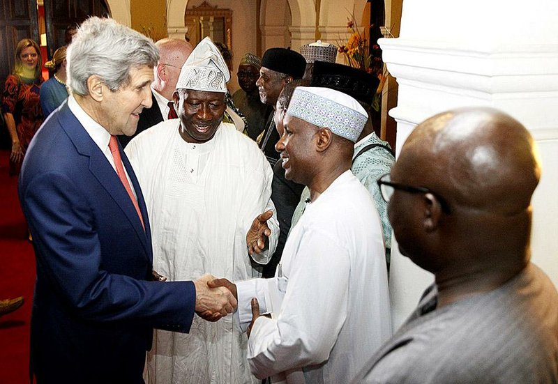 Nigeria's President, Goodluck Jonathan, 2nd left, introduces government officials to U.S. Secretary of State, John Kerry, left, at the State House in Lagos, Nigeria, Sunday, Jan. 25, 2015. In a rare high-level visit to Africa's most populous country, U.S. Secretary of State John Kerry on Sunday urged Nigeria's leading presidential candidates to refrain from fomenting violence after next month's vote, and he condemned savage attacks by Boko Haram, an al-Qaida-linked insurgency. (AP Photo/Akintunde Akinleye, Pool)