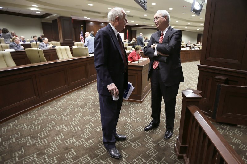 Rep. Kim Hendren, R-Gravette, left, speaks with Arkansas Department of Finance and Administration director Larry Walther after a meeting of the Joint Budget Committee at the Arkansas state Capitol in Little Rock, Ark., Tuesday, Jan. 27, 2015. 