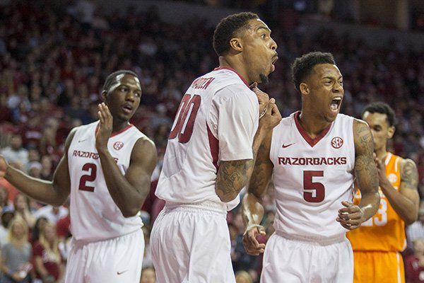 Arkansas guards Rashad Madden, center, and Athlon Bell, right, react to a foul call during the first half of an NCAA college basketball game against Tennessee on Tuesday, Jan. 27, 2015, in Fayetteville, Ark. AP Photo/Gareth Patterson)
