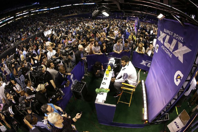 Seattle quarterback Russell Wilson, who engineered a 43-8 victory over Denver in Super Bowl XLVIII, faced the media again Tuesday during Super Bowl media day at University of Phoenix Stadium in Glendale, Ariz. 