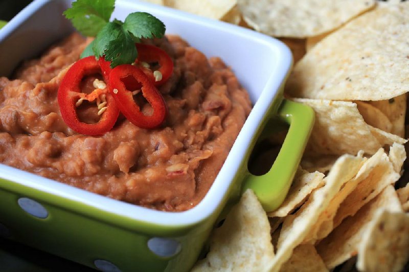 Bean dip like this Refried Chipotle-Lime Pinto Bean Dip is classic party fare. 