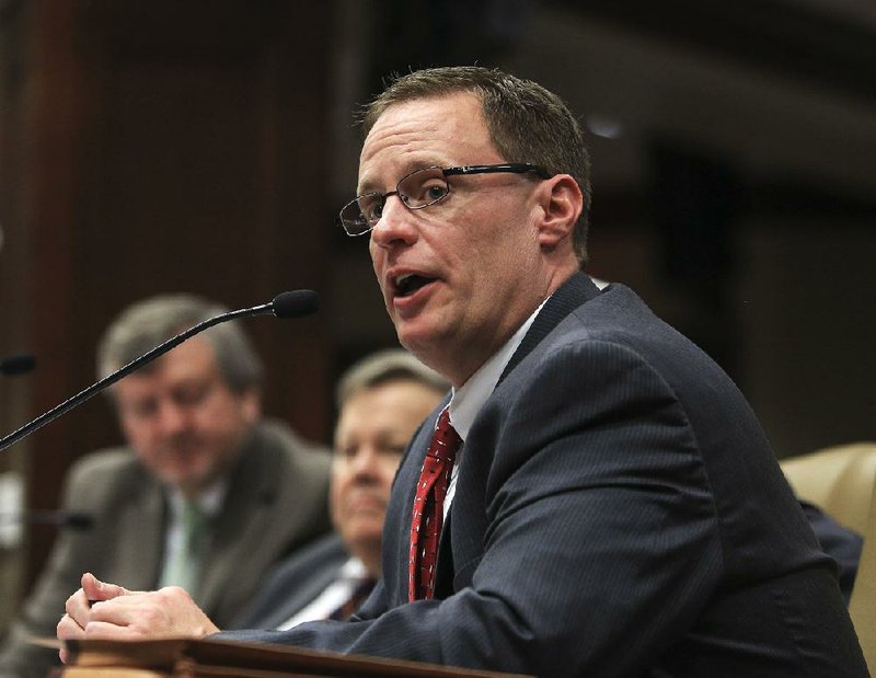 State Budget Administrator Brandon Sharp (right) gives the Joint Budget Committee details Tuesday about Gov. Asa Hutchinson’s proposed budget. 